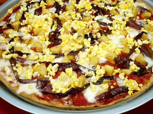 Pizza with red radicchio, potatoes and eggs