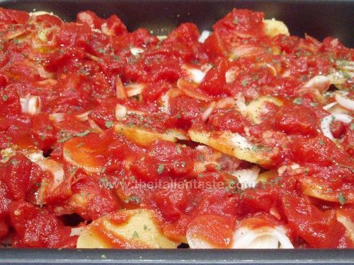Baked with potatoes, onions and tomatoes (Basilicata)